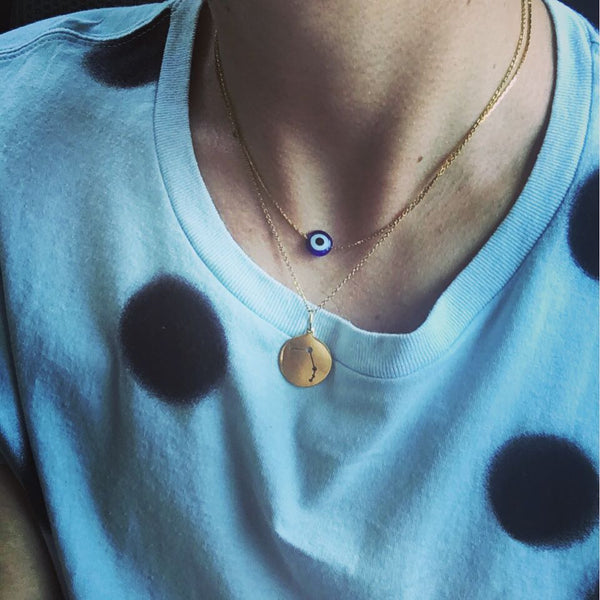 Collar medalla aries en oro.